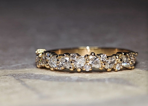 A gold wedding ring decorated with diamonds