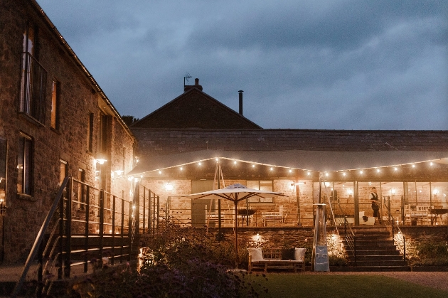 The exterior of a barn at night time