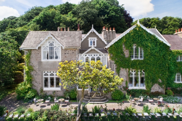 A large building with ivy covering part of it