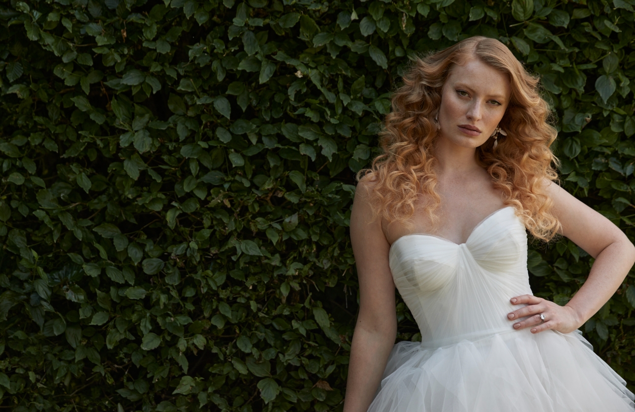 model in white wedding dress, strapless, gathered chiffon on bust, 