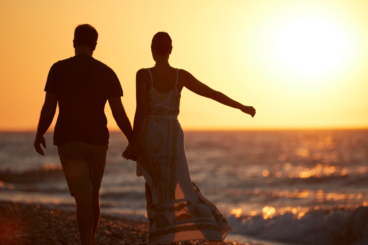 Couple walking along the beach